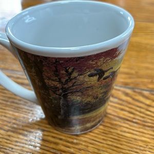 Linda Picken coffee mug.  Outdoor print w/ducks.  Approximately 4” tall.